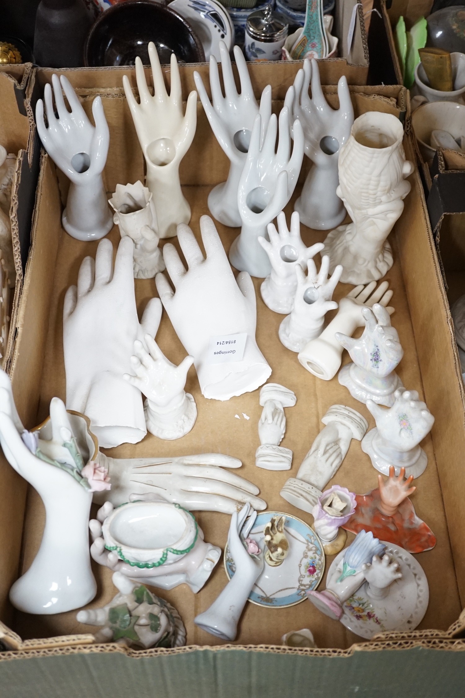 A large collection of mostly 19th century white glazed ceramics, including ring trees, model hands, figurines, vases and other coloured ceramics (five boxes)